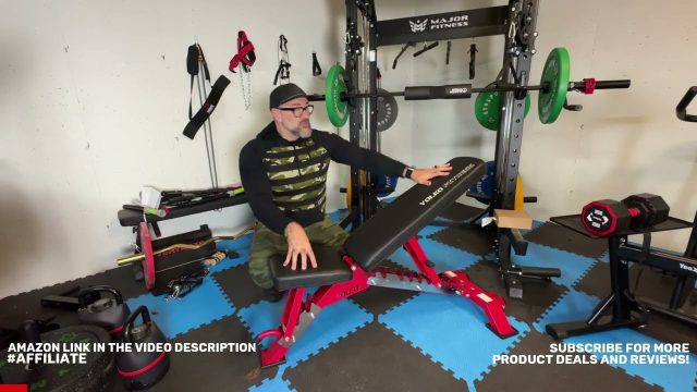 Rob adjusting the YOLEO commercial adjustable weight bench in his home garage gym